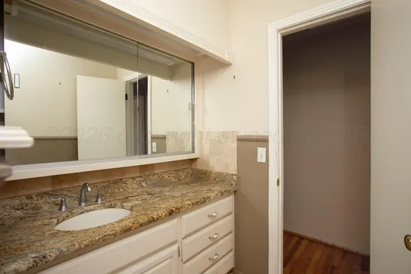 a view of an empty room with a bathroom
