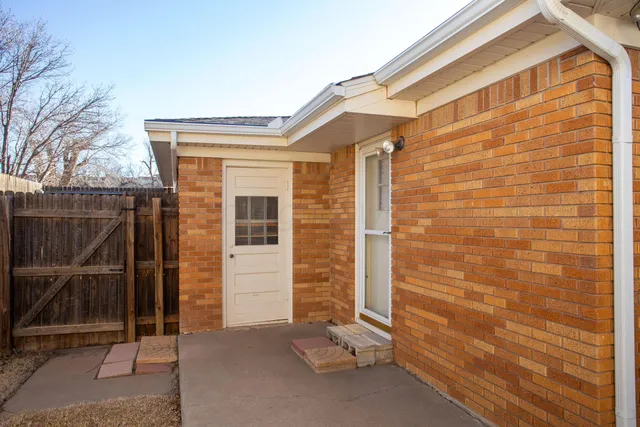 a view of front door of house with stairs