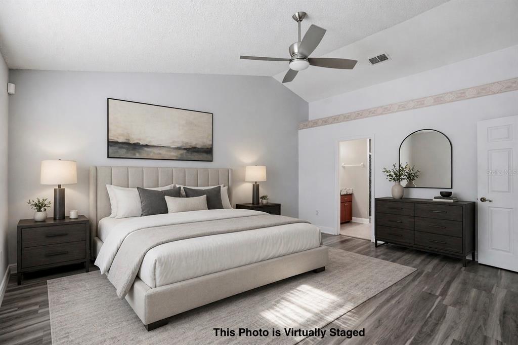 5277 Deltona Boulevard Spring Hill, FL 34606 - Photo 27 of 74 a bedroom with a bed and a dresser
