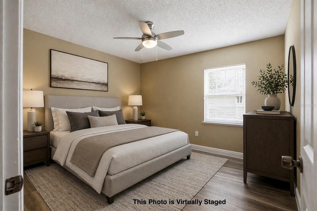 5277 Deltona Boulevard Spring Hill, FL 34606 - Photo 37 of 74 a bedroom with a bed and a window