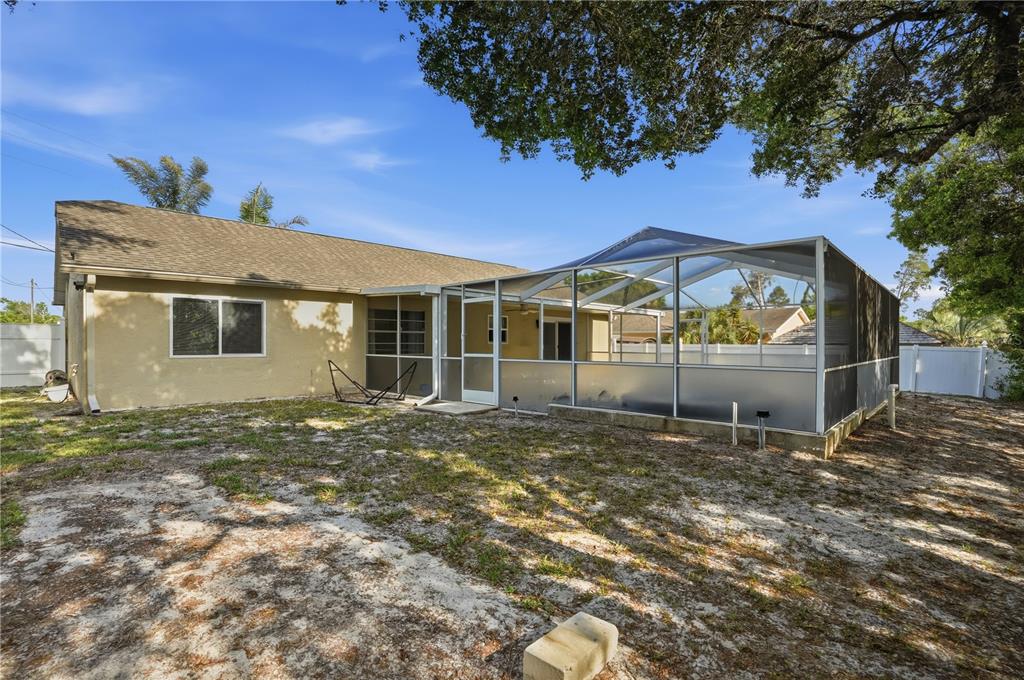 5277 Deltona Boulevard Spring Hill, FL 34606 - Photo 58 of 74 a view of a house with a yard