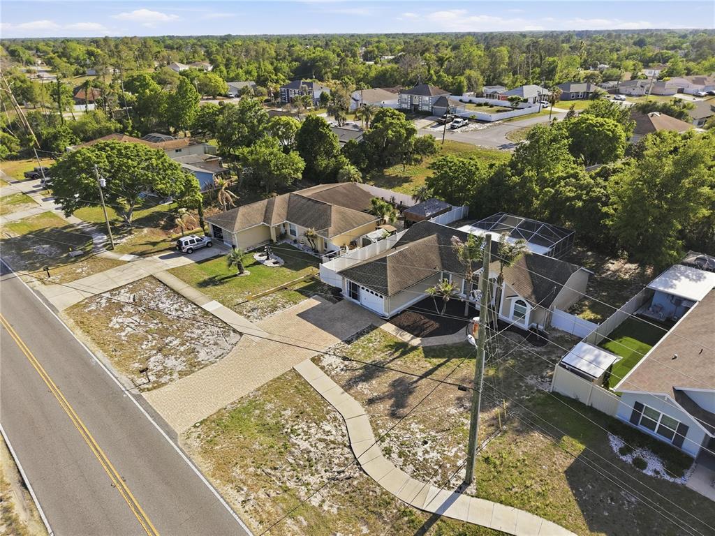 5277 Deltona Boulevard Spring Hill, FL 34606 - Photo 67 of 74 an aerial view of residential houses with outdoor space