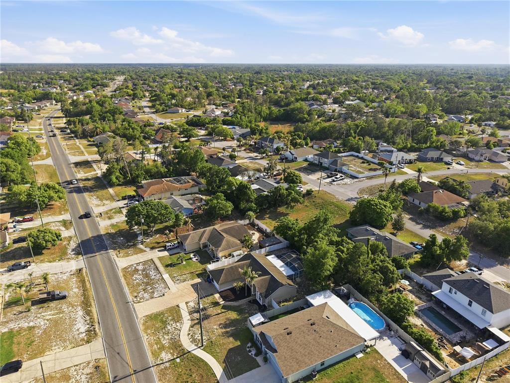 5277 Deltona Boulevard Spring Hill, FL 34606 - Photo 68 of 74 an aerial view of residential houses with outdoor space