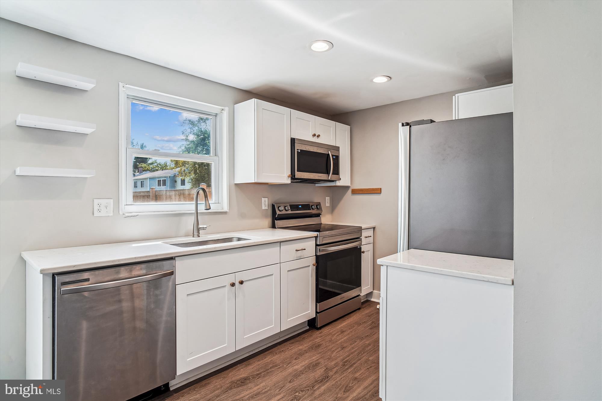 1708 Heather Lane Frederick, MD 21702 - Photo 15 of 47 a kitchen with a sink stove and microwave