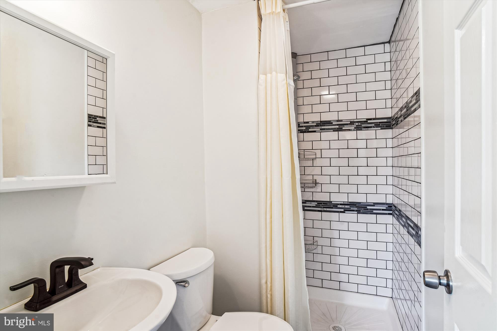 1708 Heather Lane Frederick, MD 21702 - Photo 25 of 47 a bathroom with a toilet and shower