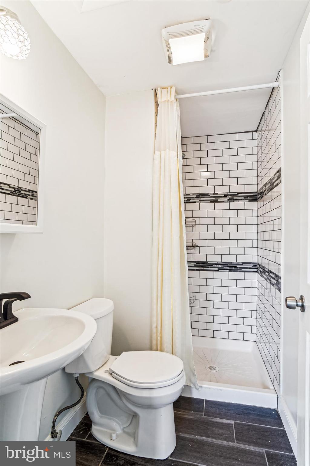 1708 Heather Lane Frederick, MD 21702 - Photo 26 of 47 a bathroom with a toilet and a shower