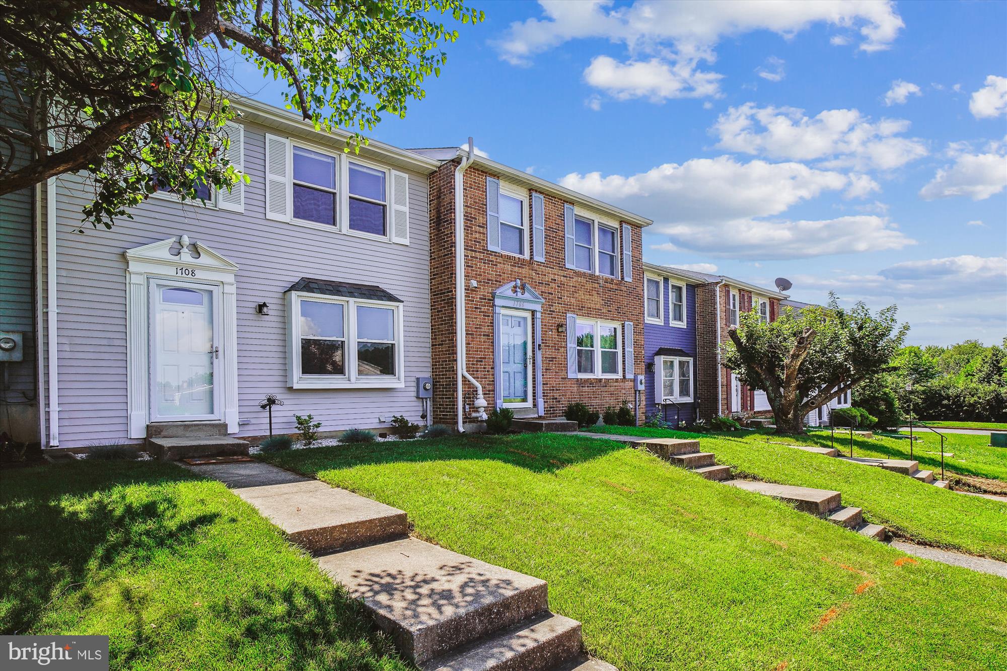 1708 Heather Lane Frederick, MD 21702 - Photo 3 of 47 a front view of a house with a yard