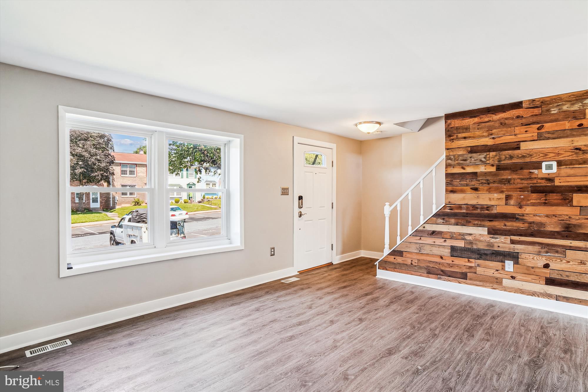 1708 Heather Lane Frederick, MD 21702 - Photo 9 of 47 wooden floor in an empty room with a window