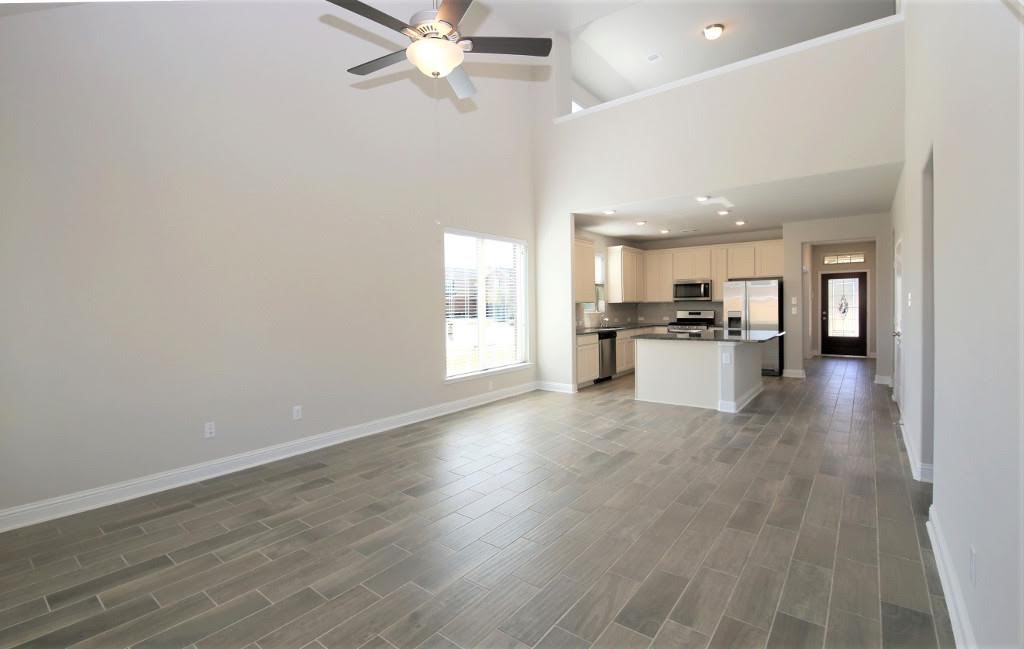 8202 Aleppo Pine Lane Cypress, TX 77433 - Photo 12 of 31 a view of a kitchen with a sink a refrigerator and window