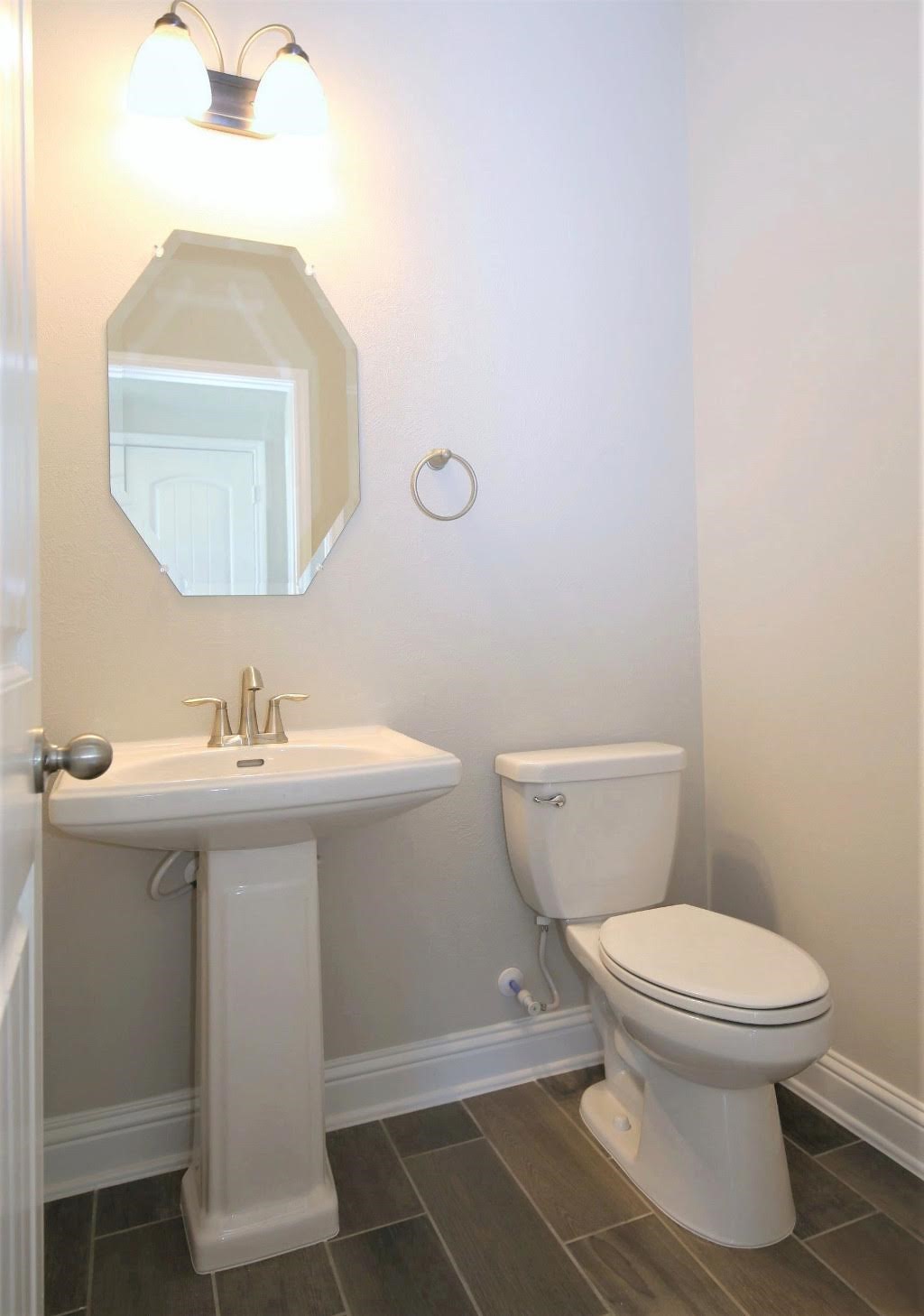 8202 Aleppo Pine Lane Cypress, TX 77433 - Photo 14 of 31 a bathroom with a sink toilet and a mirror