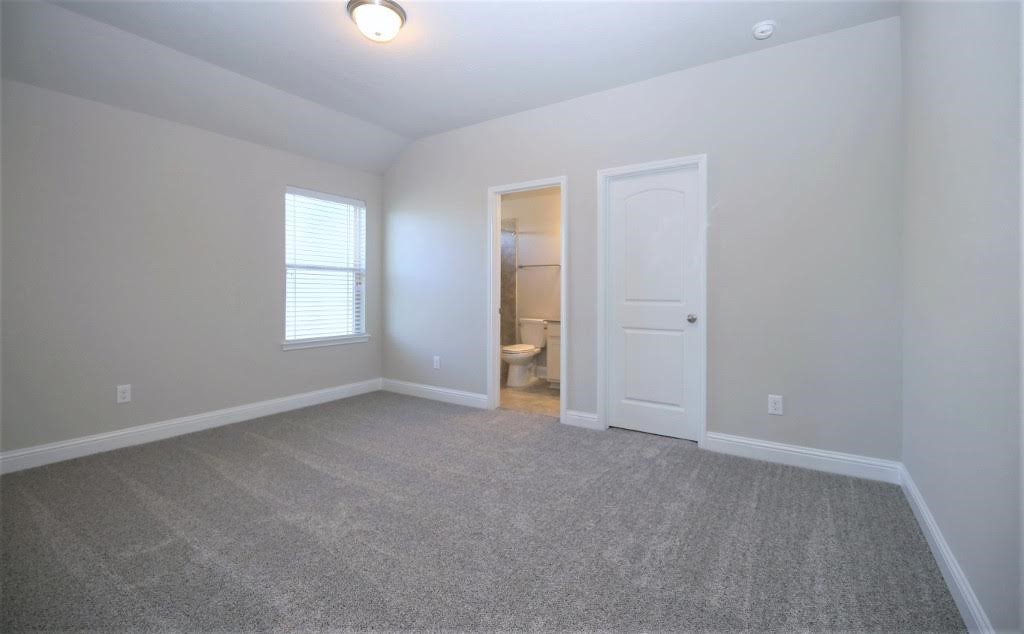 8202 Aleppo Pine Lane Cypress, TX 77433 - Photo 23 of 31 an empty room with windows and closet