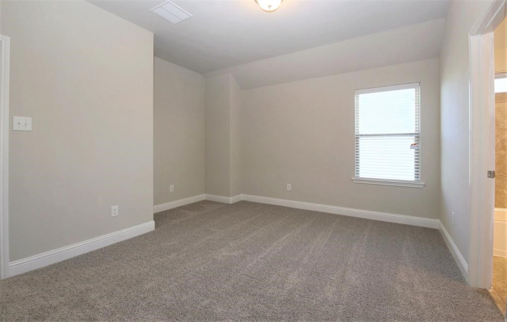 8202 Aleppo Pine Lane Cypress, TX 77433 - Photo 24 of 31 an empty room with a window