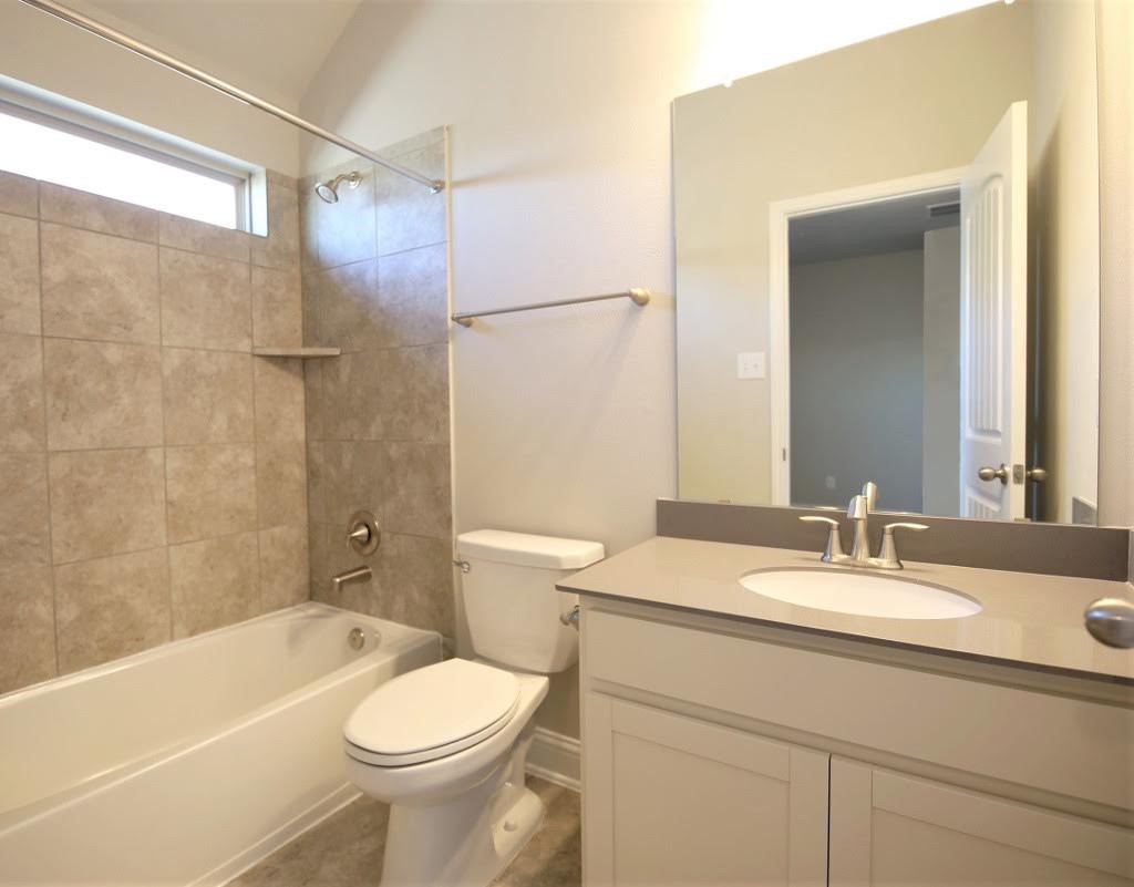 8202 Aleppo Pine Lane Cypress, TX 77433 - Photo 25 of 31 a bathroom with a sink toilet and shower