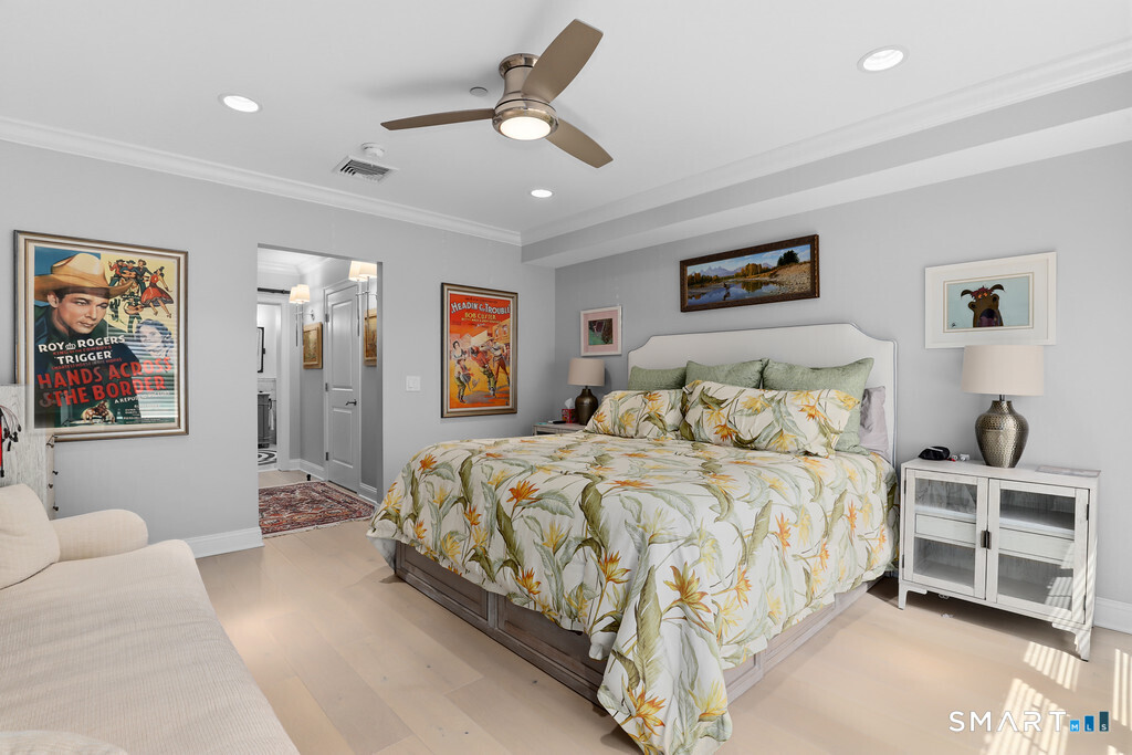 16 Hayestown Road, Unit D102 Danbury, CT 06811 - Photo 13 of 29 a bedroom with a large bed and a chandelier