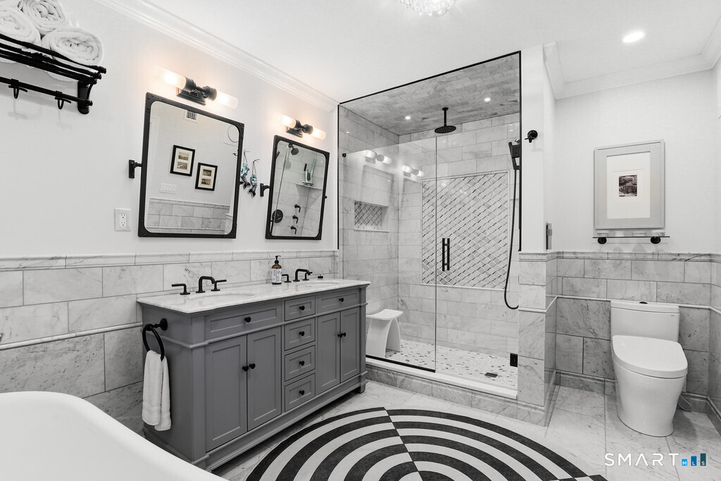 16 Hayestown Road, Unit D102 Danbury, CT 06811 - Photo 15 of 29 a bathroom with a sink toilet and shower