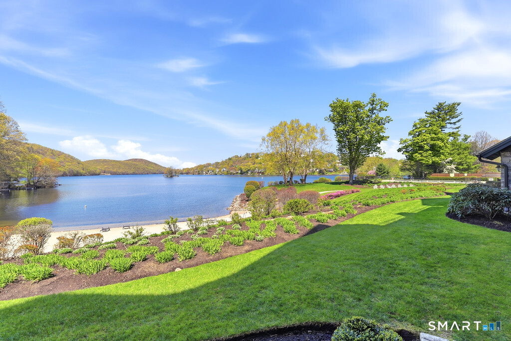 16 Hayestown Road, Unit D102 Danbury, CT 06811 - Photo 22 of 29 a view of a lake with houses in the back