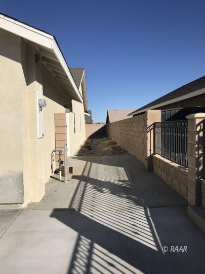 425 Randall Street Ridgecrest, CA 93555 - Photo 27 of 27 a view of a balcony with wooden floor and stairs