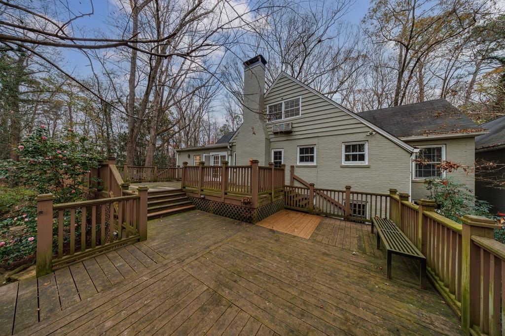 3990 Randall Mill Road Northwest Atlanta, GA 30327 - Photo 15 of 65 a view of a house with backyard and sitting area