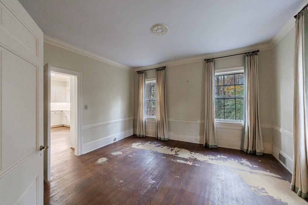 3990 Randall Mill Road Northwest Atlanta, GA 30327 - Photo 26 of 65 an empty room with wooden floor and windows