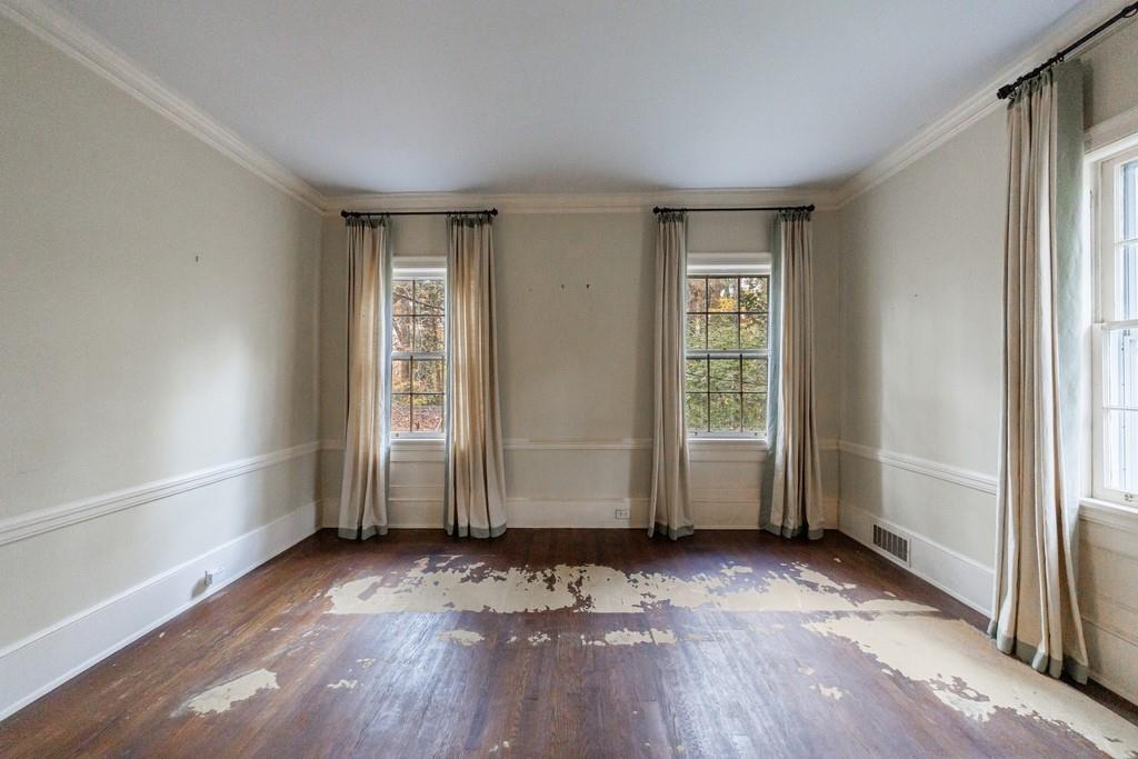 3990 Randall Mill Road Northwest Atlanta, GA 30327 - Photo 27 of 65 an empty room with wooden floor and windows