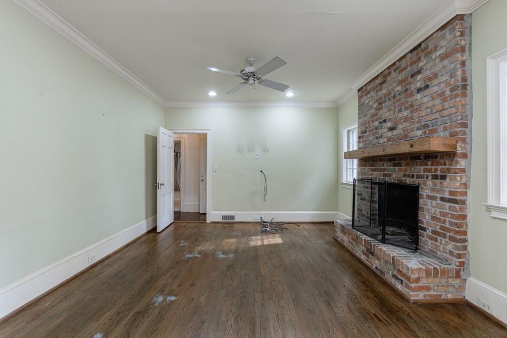 3990 Randall Mill Road Northwest Atlanta, GA 30327 - Photo 37 of 65 wooden floor fireplace and natural light in empty room