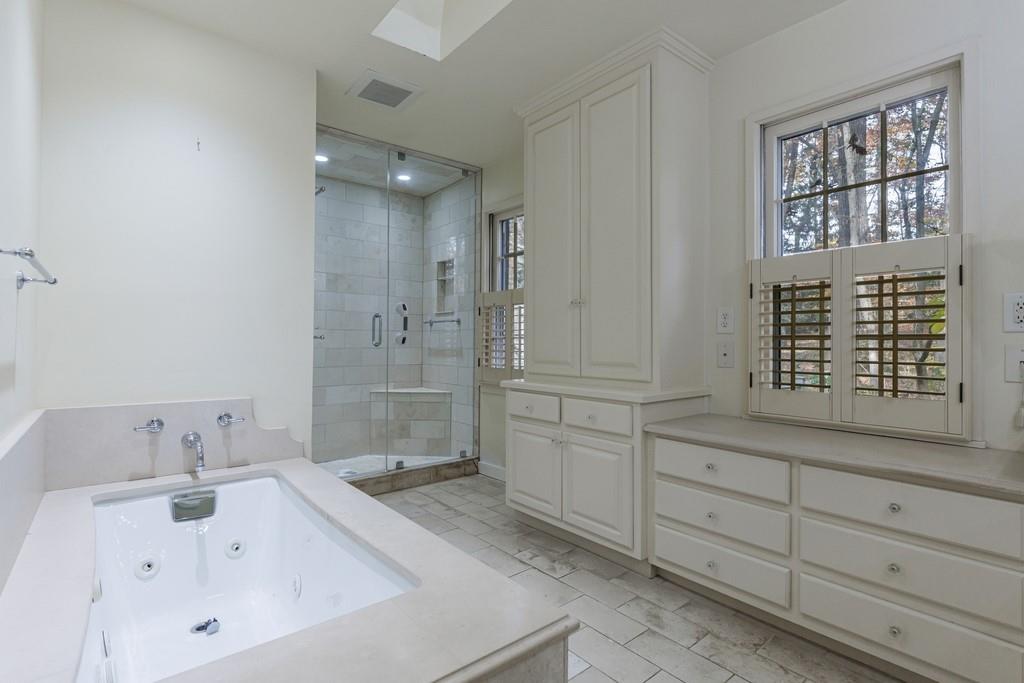 3990 Randall Mill Road Northwest Atlanta, GA 30327 - Photo 48 of 65 a bathroom with a sink and a tub