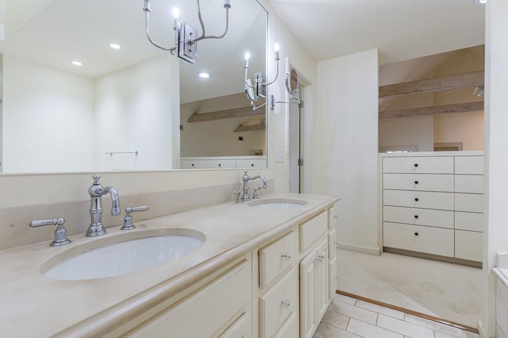 3990 Randall Mill Road Northwest Atlanta, GA 30327 - Photo 49 of 65 a bathroom with a sink vanity granite and a mirror