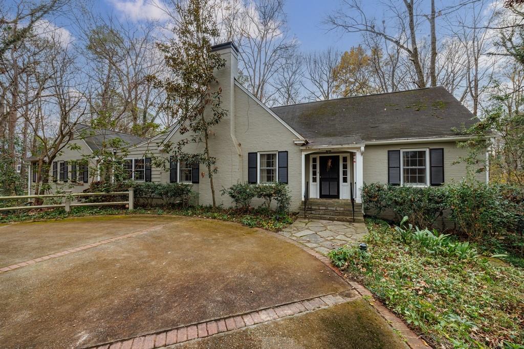 3990 Randall Mill Road Northwest Atlanta, GA 30327 - Photo 5 of 65 a front view of a house with a yard