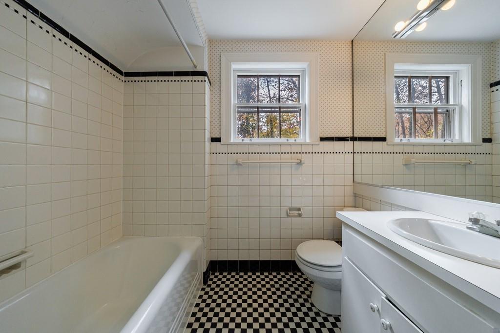3990 Randall Mill Road Northwest Atlanta, GA 30327 - Photo 55 of 65 a bathroom with a sink a toilet and a bathtub
