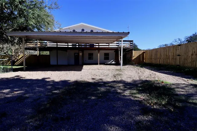 a view of a house with a snow in the yard