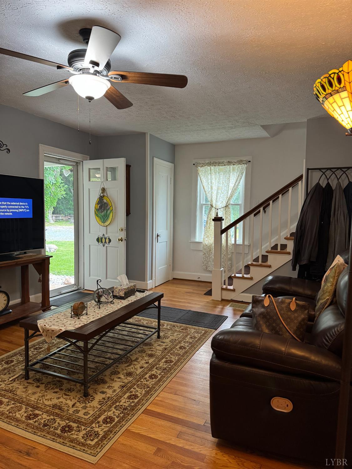 100 New Chapel Road Rustburg, VA 24588 - Photo 11 of 44 a living room with furniture and wooden floor