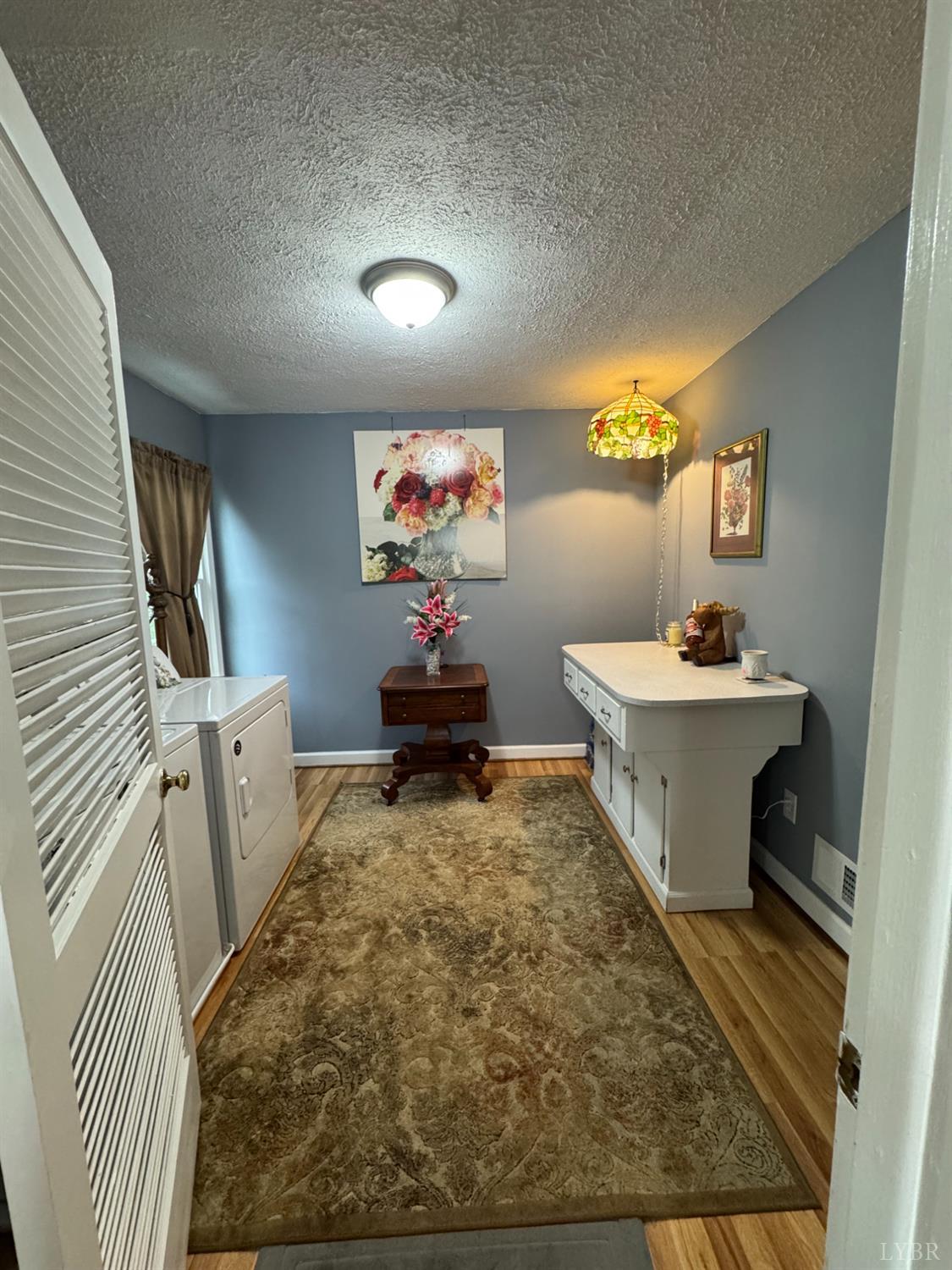 100 New Chapel Road Rustburg, VA 24588 - Photo 17 of 44 a bathroom with a sink a mirror and toilet