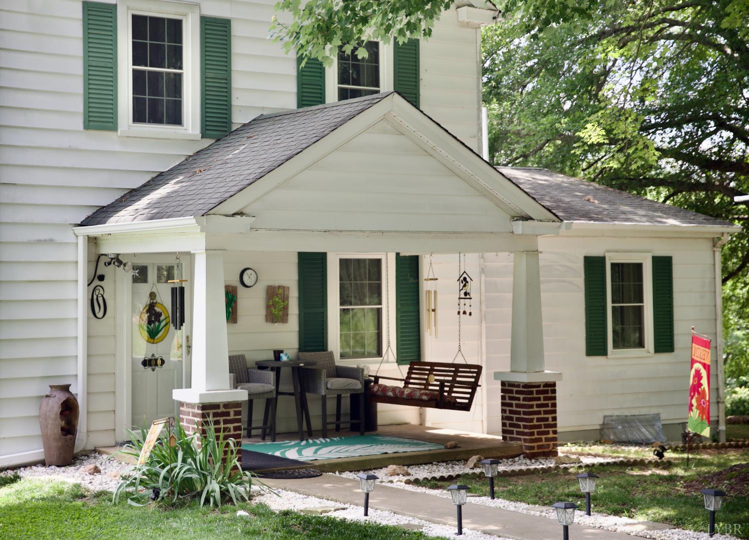 100 New Chapel Road Rustburg, VA 24588 - Photo 2 of 44 a front view of a house with garden