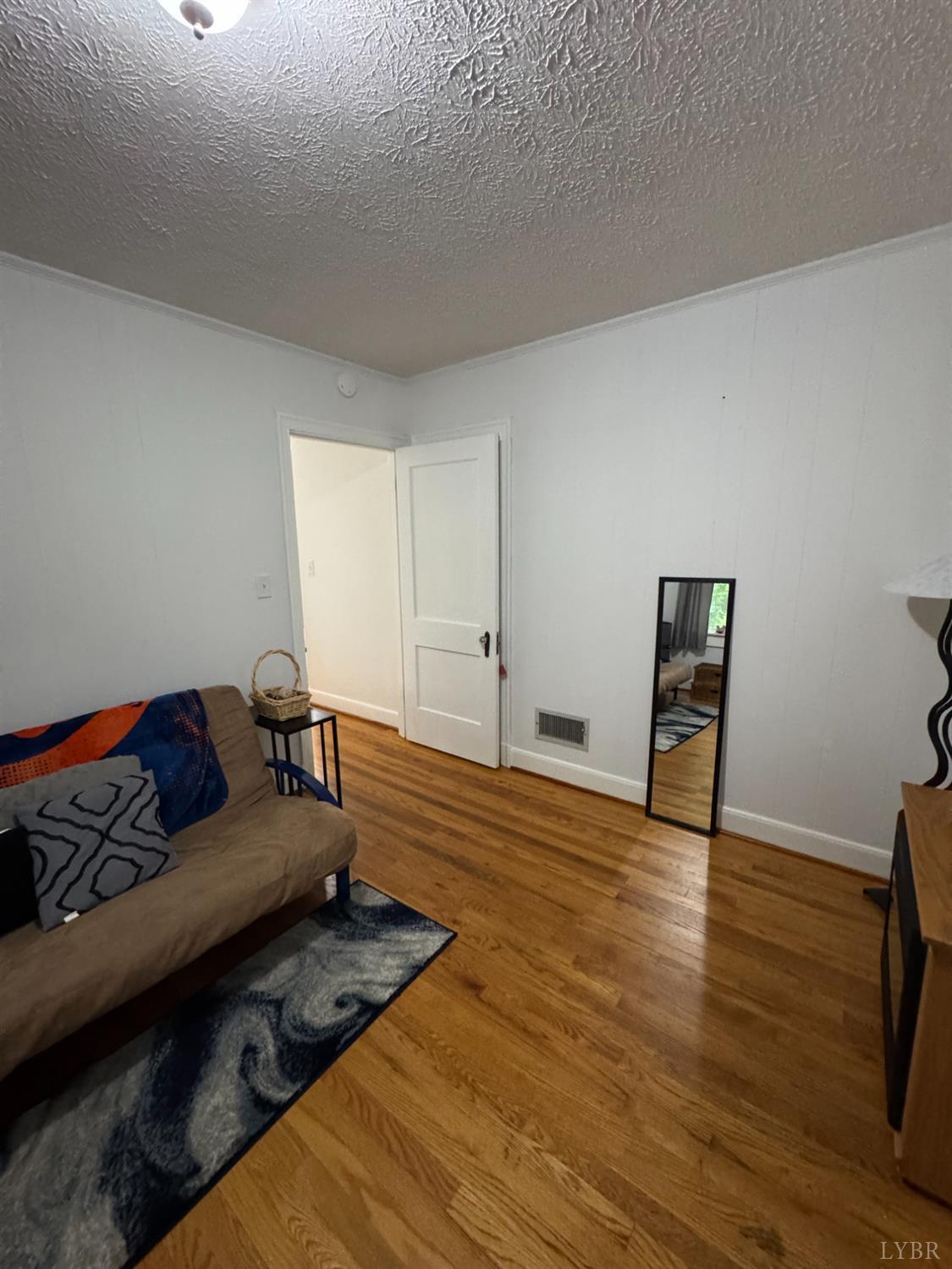 100 New Chapel Road Rustburg, VA 24588 - Photo 26 of 44 a living room with furniture and wooden floor