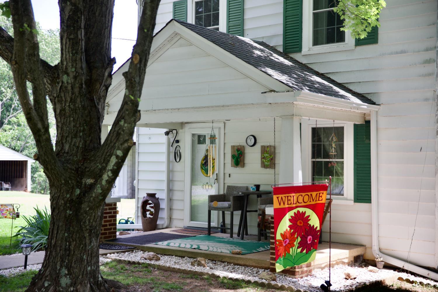 100 New Chapel Road Rustburg, VA 24588 - Photo 3 of 44 a front view of a house with garden