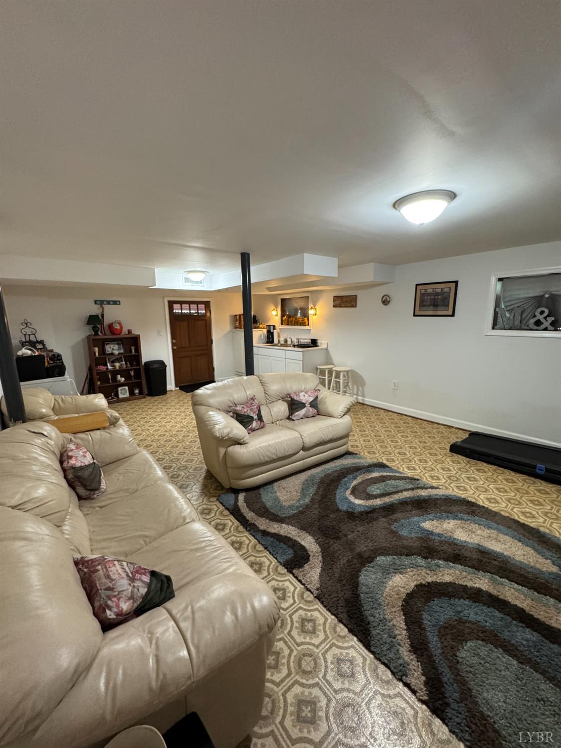 100 New Chapel Road Rustburg, VA 24588 - Photo 32 of 44 a living room with furniture and a couch