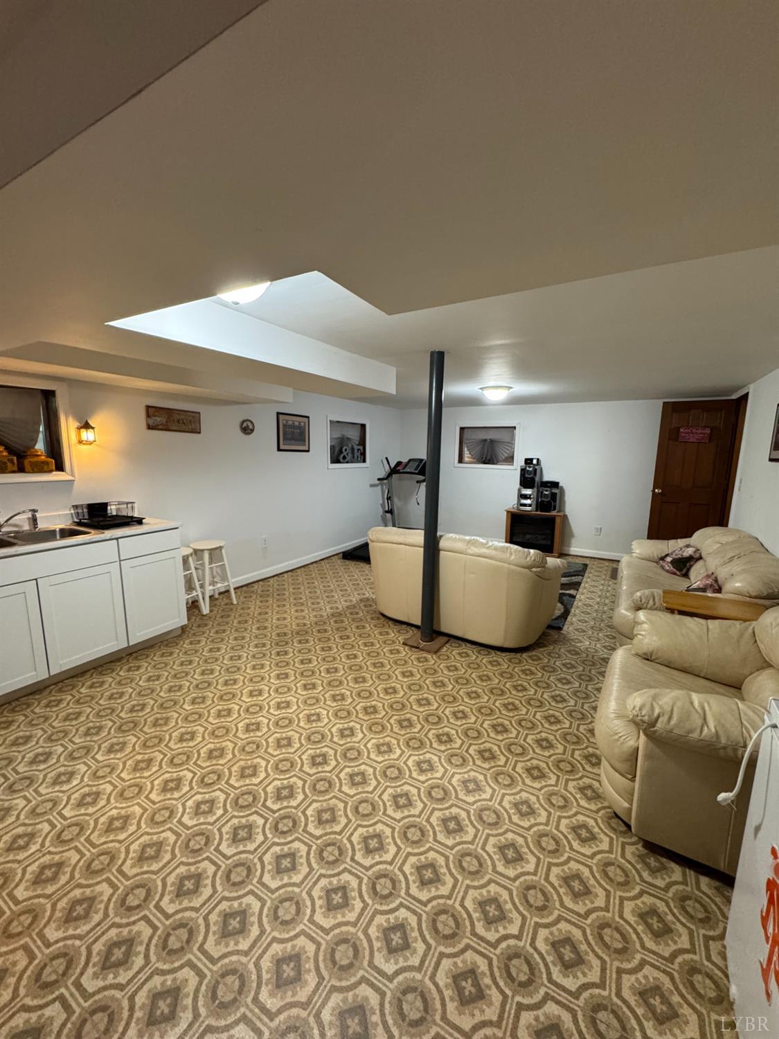 100 New Chapel Road Rustburg, VA 24588 - Photo 33 of 44 a living room with furniture and a flat screen tv
