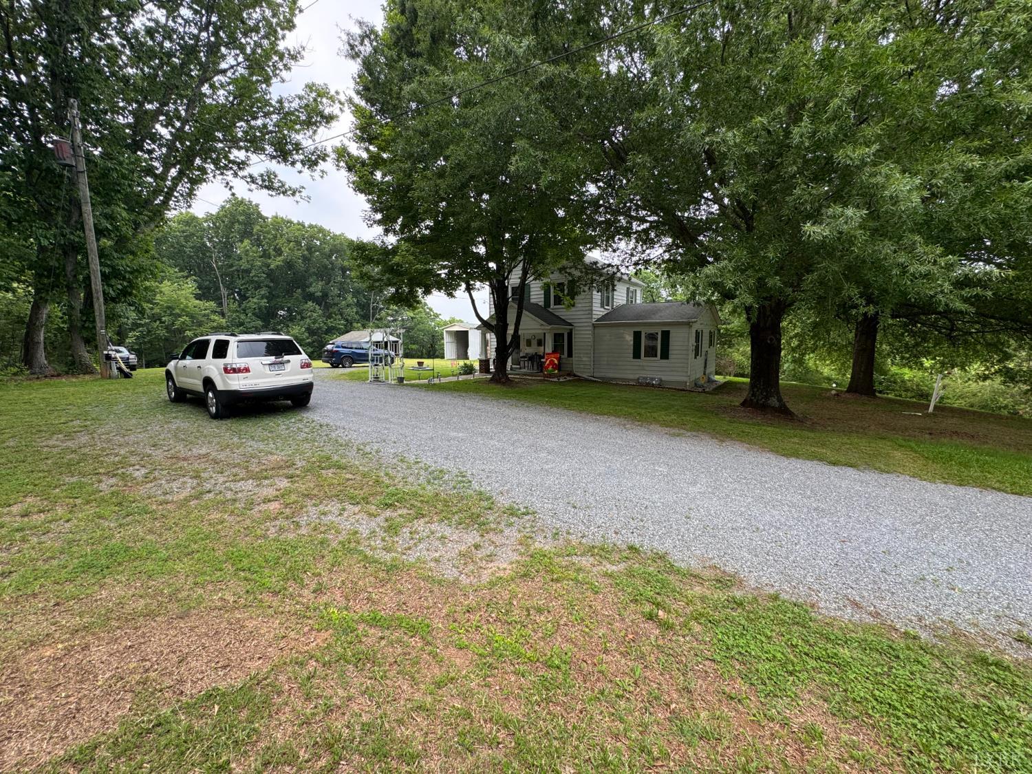 100 New Chapel Road Rustburg, VA 24588 - Photo 35 of 44 a view of a backyard with a car parked