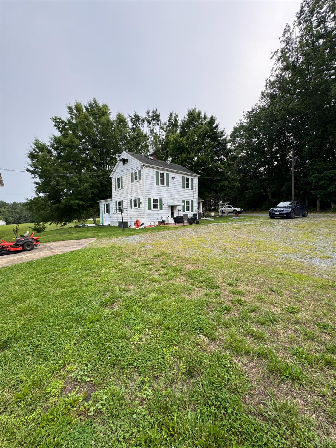100 New Chapel Road Rustburg, VA 24588 - Photo 39 of 44 a white house with a big yard and large trees