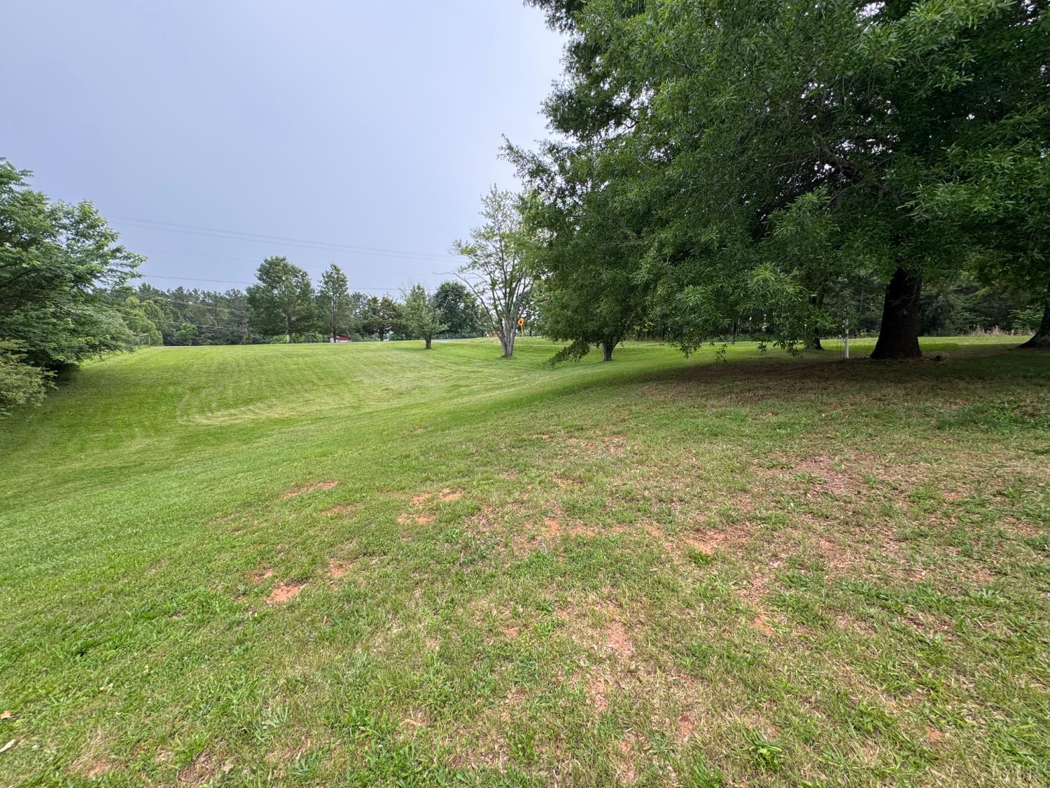 100 New Chapel Road Rustburg, VA 24588 - Photo 9 of 44 a view of a green yard