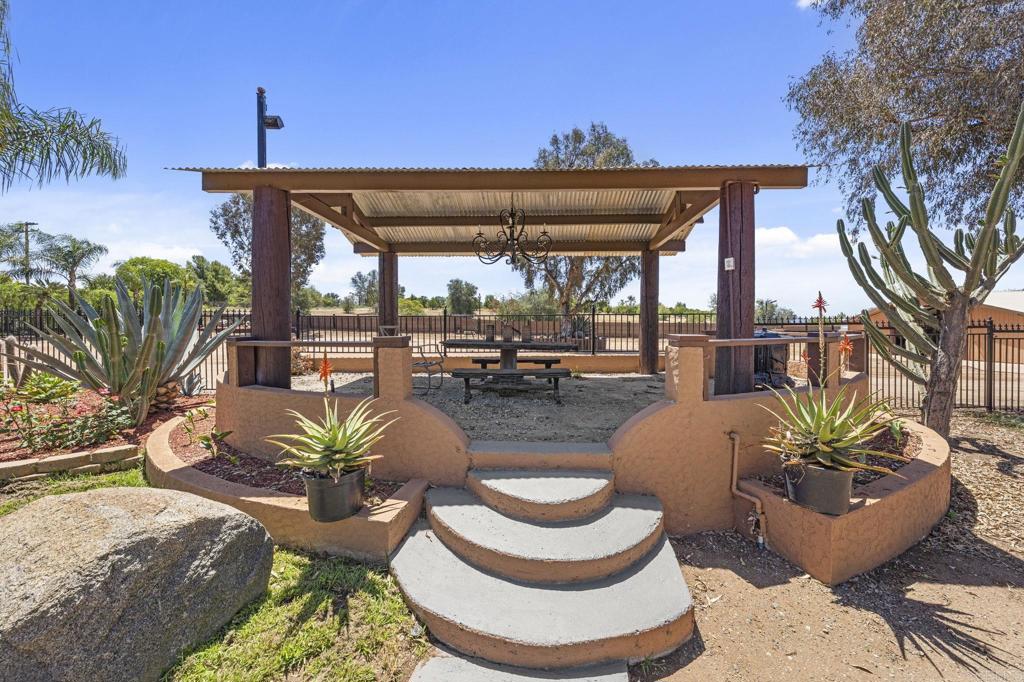 30265 Miller Road Valley Center, CA 92082 - Photo 38 of 56 a swimming pool with outdoor seating yard and furniture