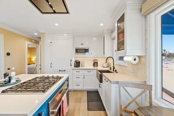 a kitchen with stainless steel appliances granite countertop a stove and a sink
