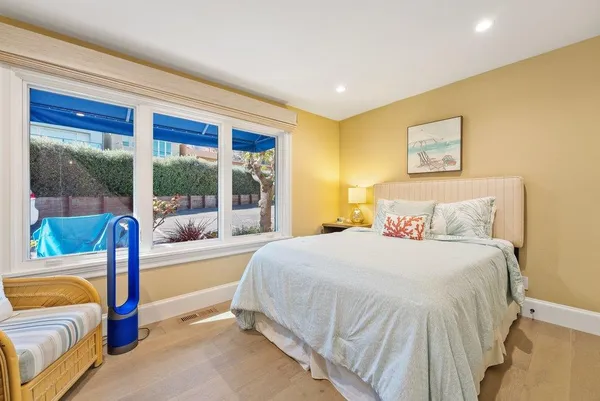 a bedroom with a bed and a couch