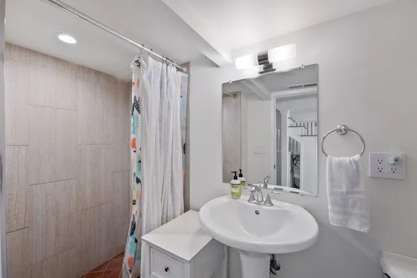 a view of a hallway with washer and dryer