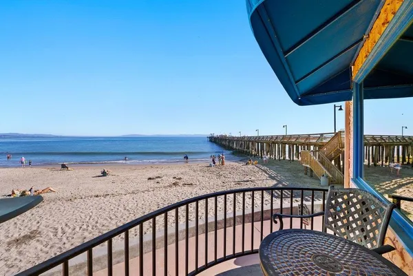a view of a roof deck with wooden fence