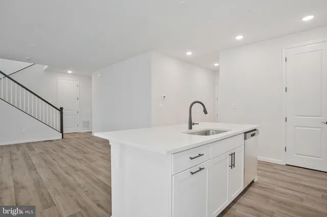 a bathroom with a sink and mirror