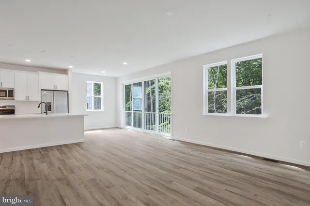 a view of kitchen and wooden floor