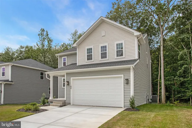 a front view of a house with a garage