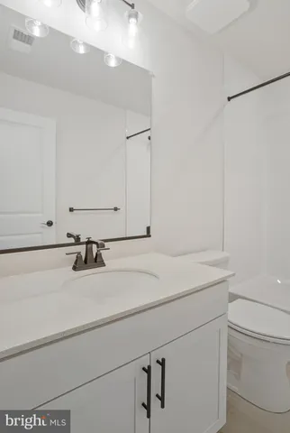 a bathroom with a sink and a toilet