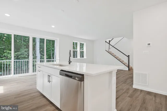 a kitchen with a sink and a window